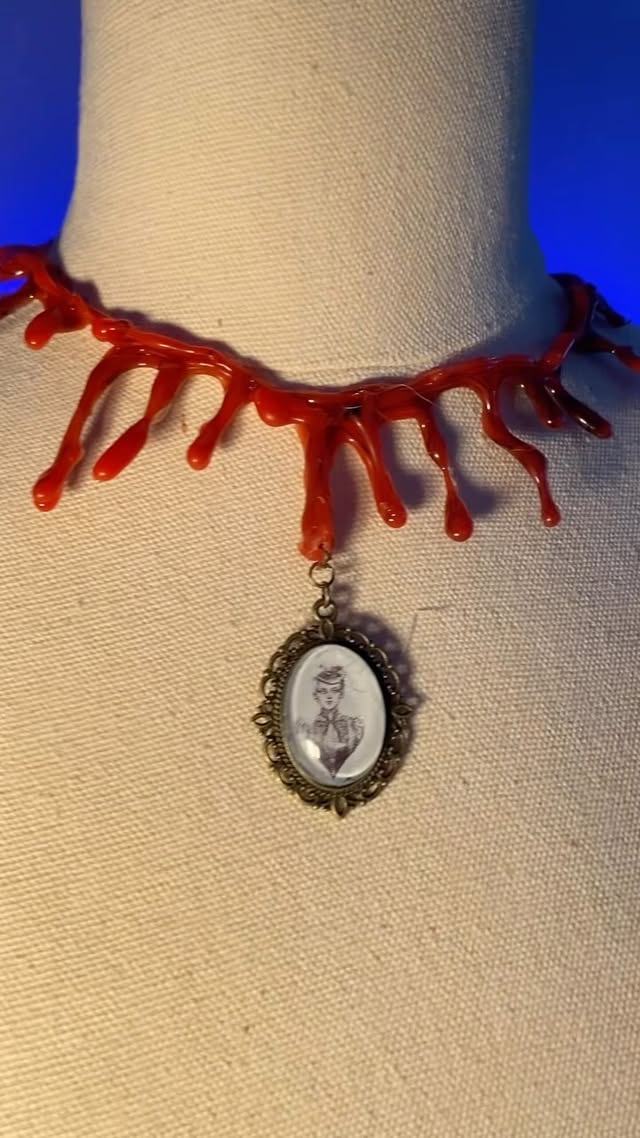 Getting ready for Halloween, I am just obsessed with the Mina Harker "Cameo". Also... how amazing is hot glue? I live for random hot glue art!
Are we all ready for Halloween? Or still working at it? 
We are still working hard, it has been a process.

#lollyinwonderland #halloween #spookyseason #somedaysaredarker #dracula #bramstokersdracula #minaharker #necklace #bloodnecklace #horror #obsessed #deadromance #hotglue #hotgluegun #hotgluecrafts #hotglueart #resin #vintage #cameo #cameonecklace